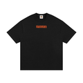 A black short-sleeve crewneck t-shirt with the word 'masonry' printed in orange across the chest, displayed flat against a solid black