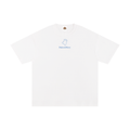 Three models shown from the back wearing white t-shirts with a blue graphic print on the back. The graphic features the text 'MAISON MAONY' and a line drawing of dogs